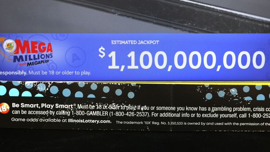 Lottery jackpots are soaring past the billion-dollar mark more frequently, thanks to higher interest rates and several rules changes. Here, a ticket machine displays the projected jackpot for a Mega Millions drawing in Chicago, in early January.