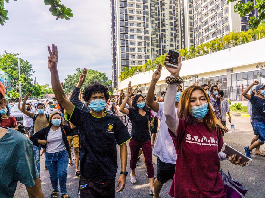 Protesters make the three-finger salute during a demonstration against the military coup in Yangon last month.