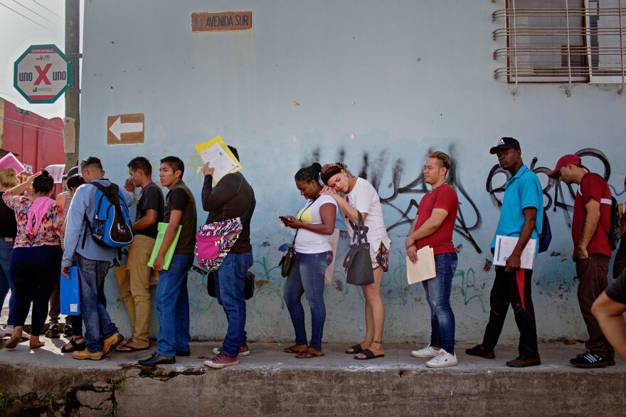 Kataleya Nativi Baca, a transgender woman from Honduras, waits in line to enter the Mexican Commission for Refugee Aid in Tapachula on Sept. 3, 2019, the day before leaving for Tijuana on the U.S./Mexico border. Baca says she did not feel safe in Tapachula because of discrimination, threats, xenophobia and "disgust" she faced.