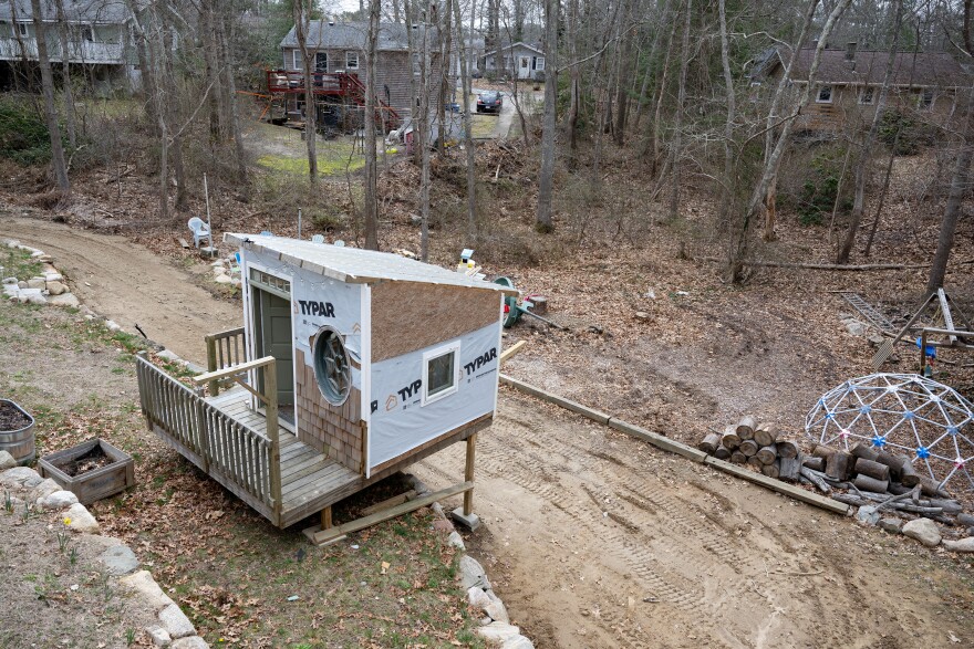 A playhouse made from some materials salvaged by WasteNot is pictured on Tuesday, April 4, 2023, at the home of Colleen Allard. WasteNot co-owners Ann Jarosiewicza and Liz Prete helped find materials to be repurposed for various projects at Allard’s home. (Raquel C. Zaldívar/New England News Collaborative)