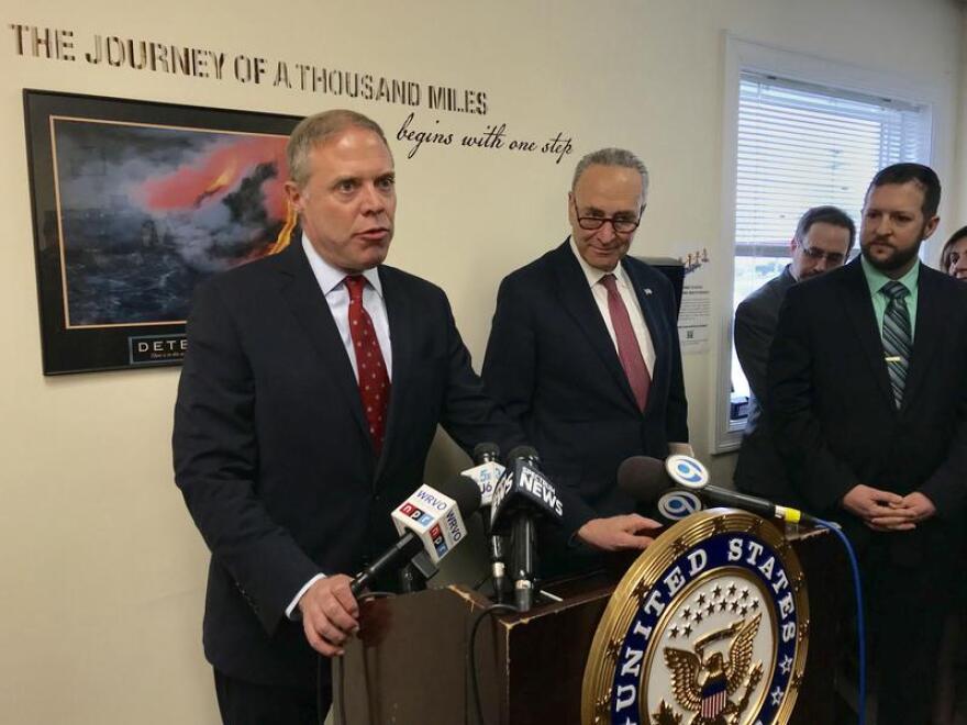 Oswego County Assemblyman Will Barclay, Sen. Charles Schumer (D-NY) and Farnham Family Services Executive Director Eric Bresee discuss the funding for battling the opioid crisis that Congress recently included in its budget. PAYNE HORNING / WRVO NEWS