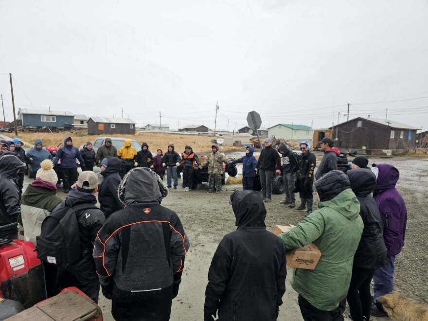 Hooper Bay residents gather for a community prayer on the evening of Oct. 10, 2025 as a storm bears down on the region