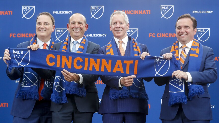 From left, FC Cincinnati General Manager and President Jeff Berding; Major League Soccer Commissioner Don Garber; FC Cincinnati owner Carl Lindner III, and Cincinnati Mayor John Cranley at the announcement of FC as an expansion team on May 29, 2018.