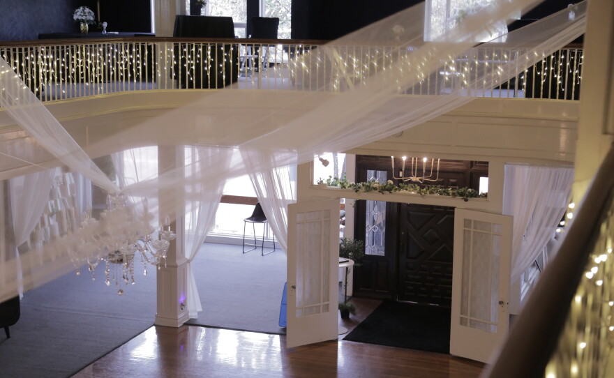 The view from the balcony down to the front door and ballroom.