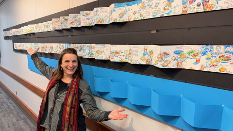 Photo of artist Kristin Pennock in front of her winning ArtPrize entry "Sketchdiet"
