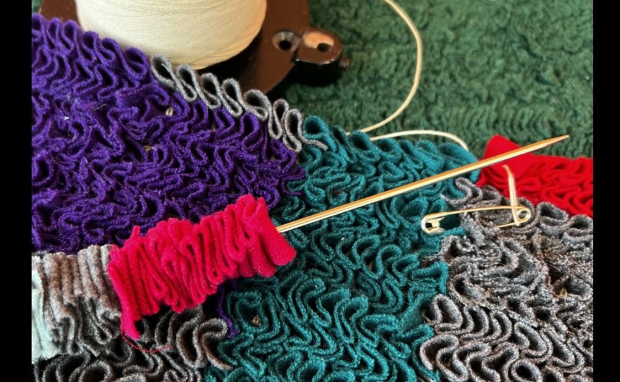 Close up image of a shirred rug in progress