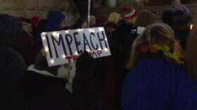 More than 100 people gathered on the steps of the Indiana Statehouse Tuesday to call on Congress to impeach President Donald Trump.