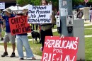 Protesters hold signs reading "Republicans for Rule of Law," "Christ is my only king," and "Without due process it's just kidnapping."