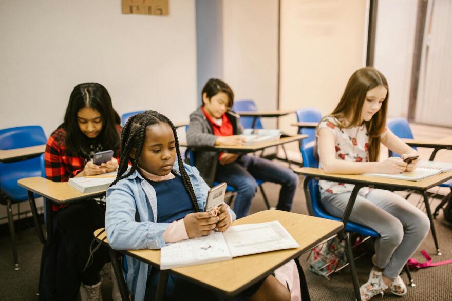 Students using their smartphones in the classroom