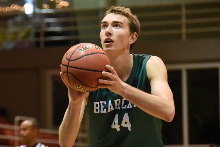 Action shot of Ryan Welty vs UIU basketball