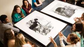 Students discuss the work of Kara Walker during class at the Cornell Fine Arts Museum, Rollins College. Photo: Scott Cook.                                       Kara Walker, Exodus of Confederates from Atlanta from Harper's Pictorial History of the Civil War (Annotated), (detail), 2005, Offset lithography and silkscreen, 39 x 53 in., The Alfond Collection of Contemporary Art, Gift of Barbara R'68 and Theodore R'68 Alfond © 2014 Kara Walker Cornell Fine Arts Museum. Photo: Scott Cook