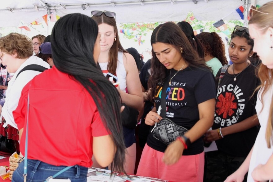 Students gather at the international booth at CultureFest, hosted by the Office of First Year Experience at Indiana University.