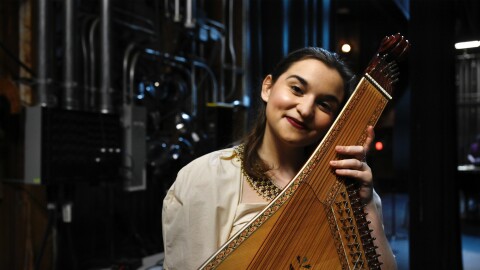 Ukrainian American musician and soprano singer Teryn Kuzma poses with her bandura instrument after a benefit concert at the Westport Country Playhouse on March 5, 2026. According to Kuzma, the bandura is a cross between a harp and a zither. Kuzma has performed at dozens of benefit concerts to raise money for Ukrainian civilians since the start of the Russian invasion in 2022.