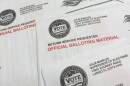stack of mail-in ballots  