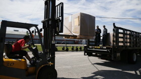 Sailors assigned to USS Gerald R. Ford's loaded truck from a warehouse in Naval Weapons Station Yorktown. 