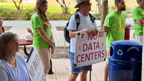 An overflow crowd packed the Palm Beach County Commission meeting to protest the "Project Tango" AI data center.