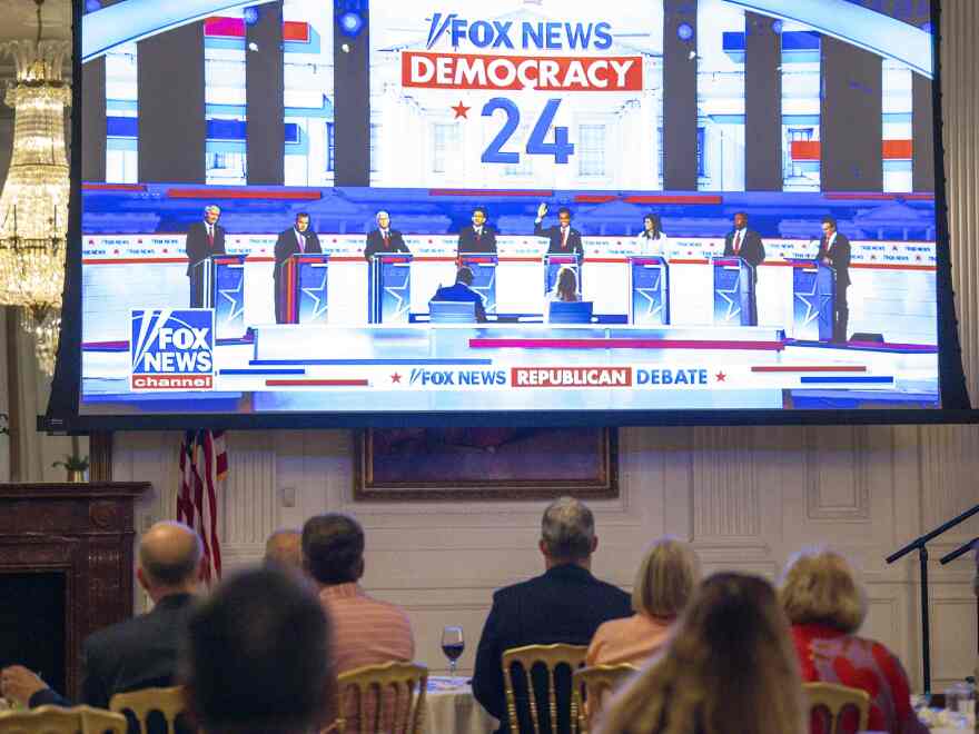Republicans and others watch the broadcast at the official watch party of the Republican presidential candidates debate at The Richard Nixon Library and Museum in Yorba Linda, Calif., on August 23.