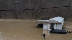 Angela Fry took this photo moments after neighbors ferried her, her disabled daughter and two dogs to safety Sunday.