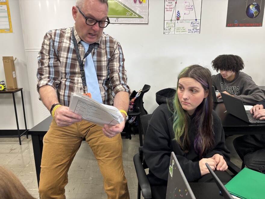 Sean Donovan helping student, Nevada Lee, with her classwork.