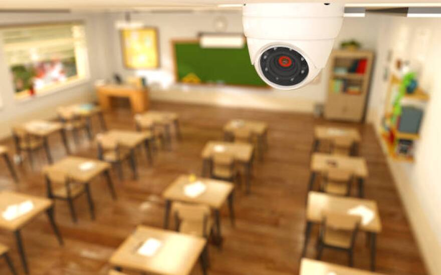 3D rendering illustration of security camera in classroom at school. CCTV camera monitoring children protection concept.3D rendering illustration of security camera in classroom at school. CCTV camera on ceiling children protection concept.