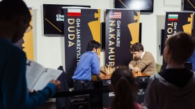 Fans crowd to watch champions Hikaru Nakamura and Jan-Krzysztof Duda play rounds of rapid and blitz matches at the St. Louis Chess Club during the Champions Showdown last week.
