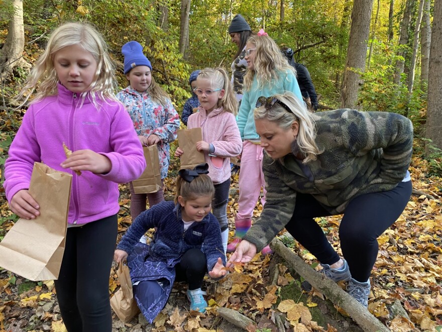 Brownies and Daisies of Troop 2160 enjoy a scavenger hunt at Highland Cemetery nature trail.