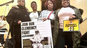 Eddie Mae Ellison, Jackie Bradford, Mary Bradford and Lois Harris hold signs urging Alabama Gov. Kay Ivey to grant clemency for their family member Charles “Sonny” Burton, Jan. 28, 2026 in Montgomery, Ala. (AP Photo/Kim Chandler)