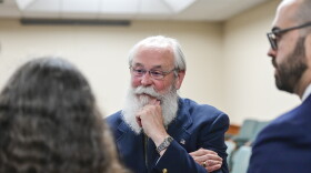Latah County Prosecutor Bill Thompson speaks with Wendy Olson, left, and Cory Carone during a motion hearing regarding a gag order for a case against Bryan Kohberger in Latah County District Court, Friday, June 9, 2023, in Moscow, Idaho. Kohberger is accused of killing four University of Idaho students in November 2022. (Zach Wilkinson/The Moscow-Pullman Daily News via AP, Pool)