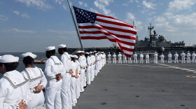 Sailors on board USS Arlington man the rails as the ship commemorates the 25th anniversary of 9/11.