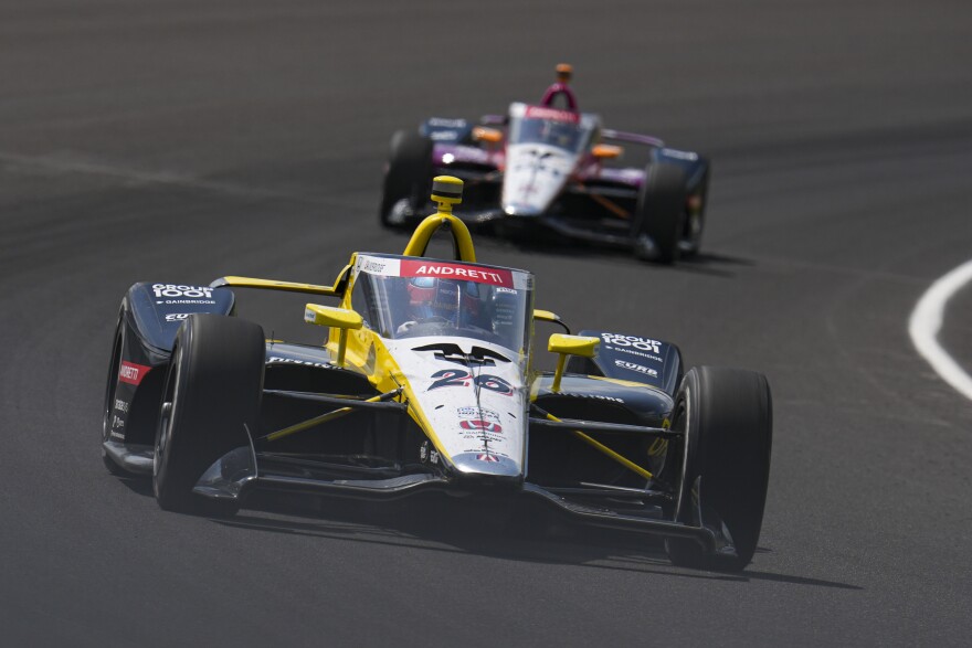 Colton Herta drives through the first turn during practice for the Indianapolis 500 auto race at Indianapolis Motor Speedway in Indianapolis, Thursday, May 15, 2025.