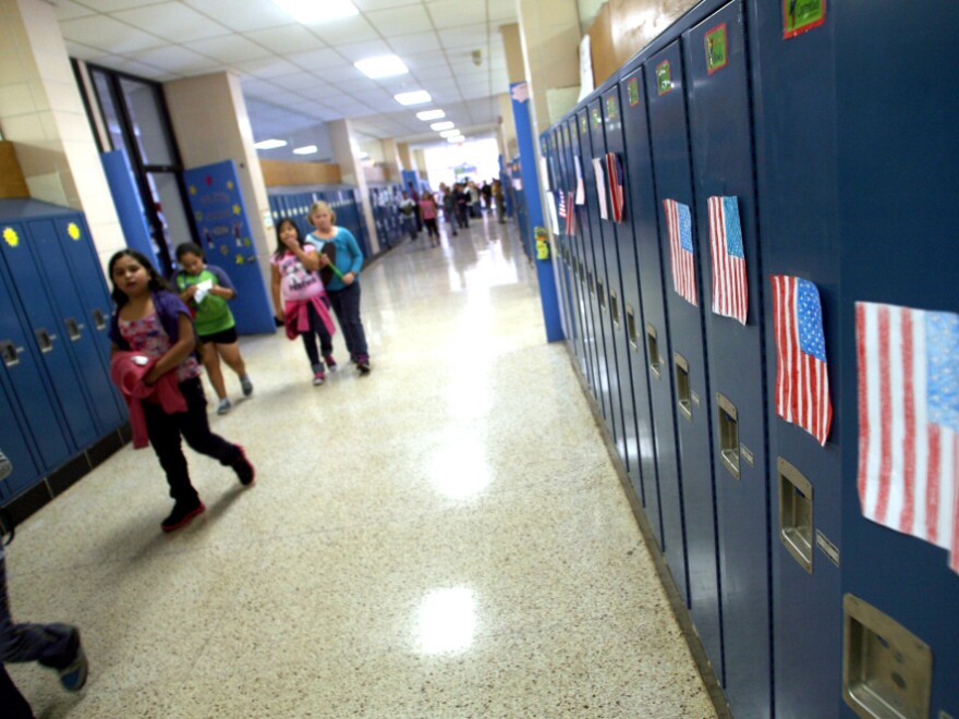 <p>Students walk through the hallways of West Liberty Elementary School. Schools in the town were the first in the state to offer dual-language programs. </p>