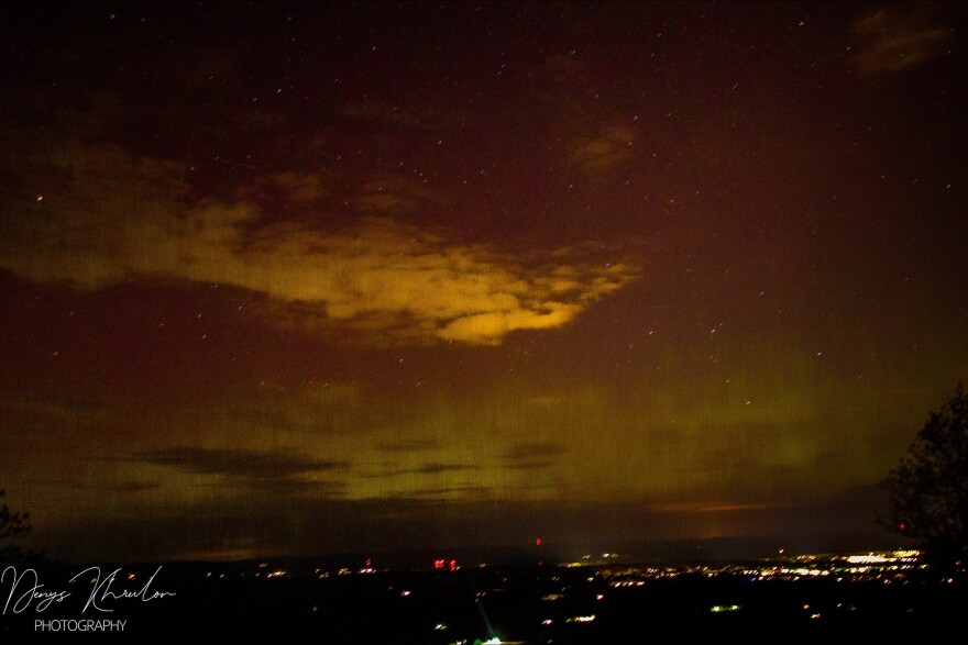 Green lights seen in a a cloudy sky