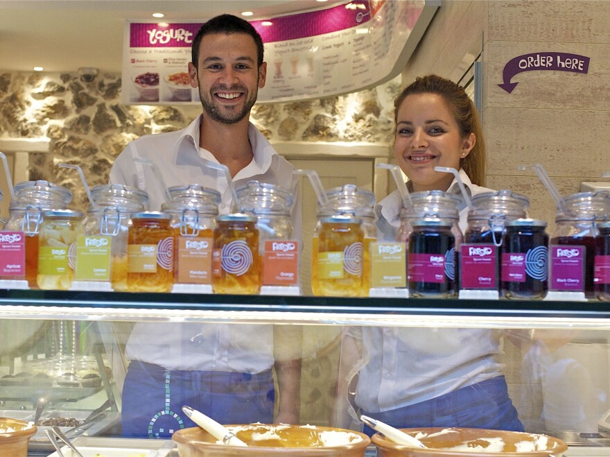 Dimitris Plassas and Georgia Ladopoulou work the yogurt bar at Fresko, which specializes in several varieties of Greek-style yogurt.