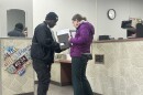 Louis reapplies for a new Ohio driver's license at the DMV on Bechtle Avenue in Springfield. In 2021, he fled dangerous gangs in Haiti and moved to the city. ABLE attorney Brandy Keesee assists him with paperwork.