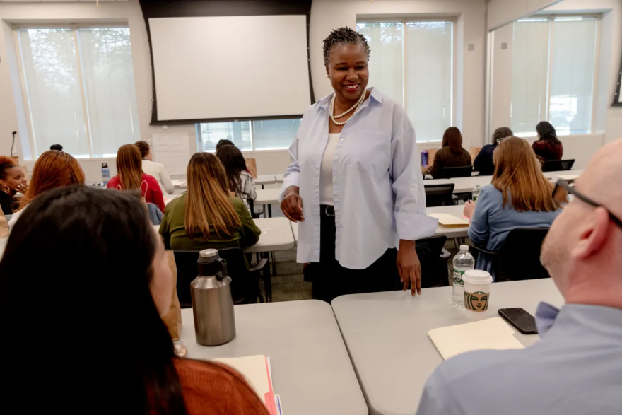 TaShun Bowden-Lewis says hello to the staff of the public defender division before a meeting. "I'm not in some ivory tower. I'm actually accessible and approachable," Bowden-Lewis said.