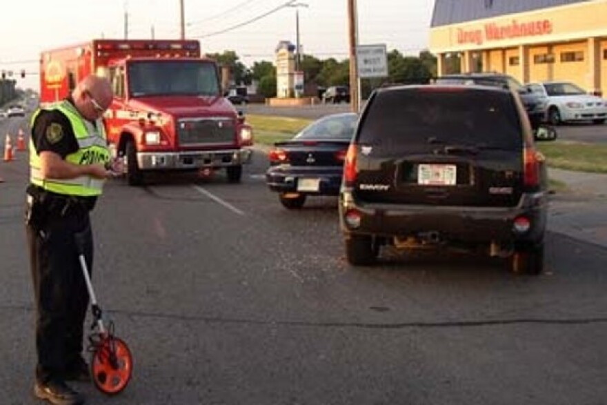 A Broken Arrow Police Officer investigates an accident at Houston and Aspen (81st and 145th East)