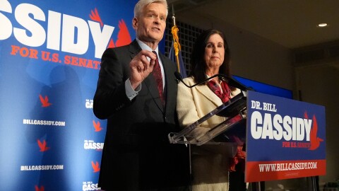 Sen. Bill Cassidy, R-La., left, speaks to supporters alongside his wife, Laura, during an election night watch party Saturday, May 16, 2026, in Baton Rouge, La.