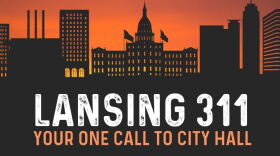 Designed silhouette of Lansing's capitol building with the following words at the bottom: 'Lansing 311. Your One Call To City Hall'. 