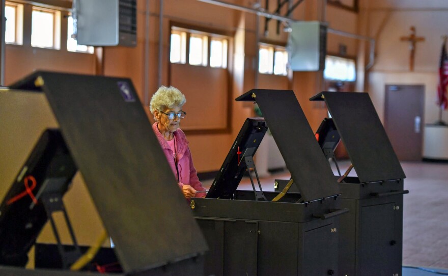 Judge of Elections Shirley Redick readies a polling machine for the 2024 Pennsylvania