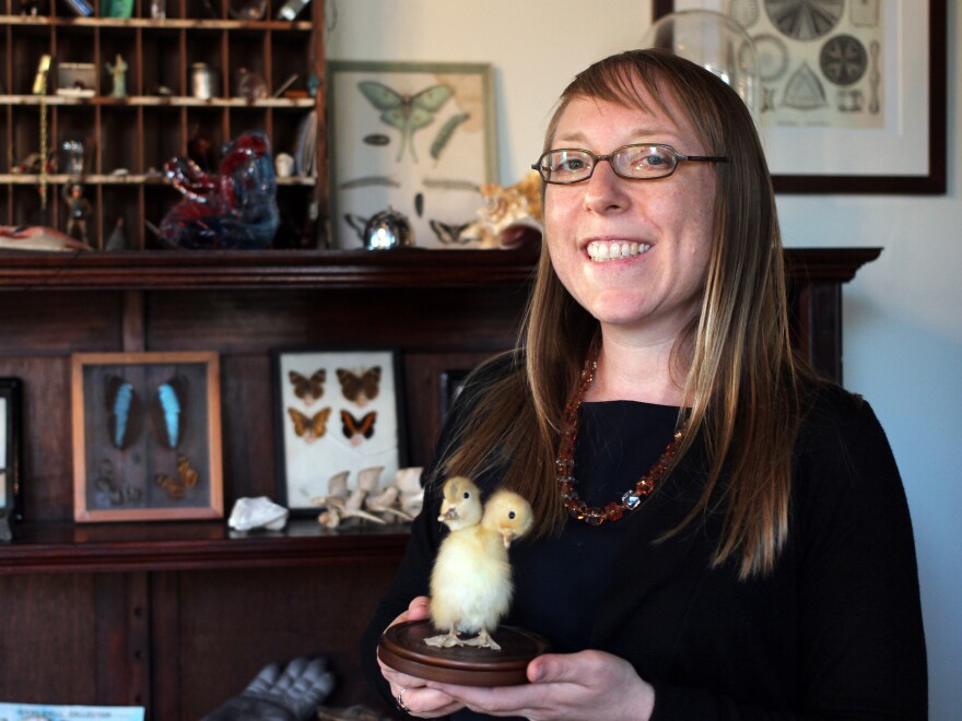 Joanna Ebenstein, creative director of the Morbid Anatomy Museum, poses with a taxidermy two-headed duckling.