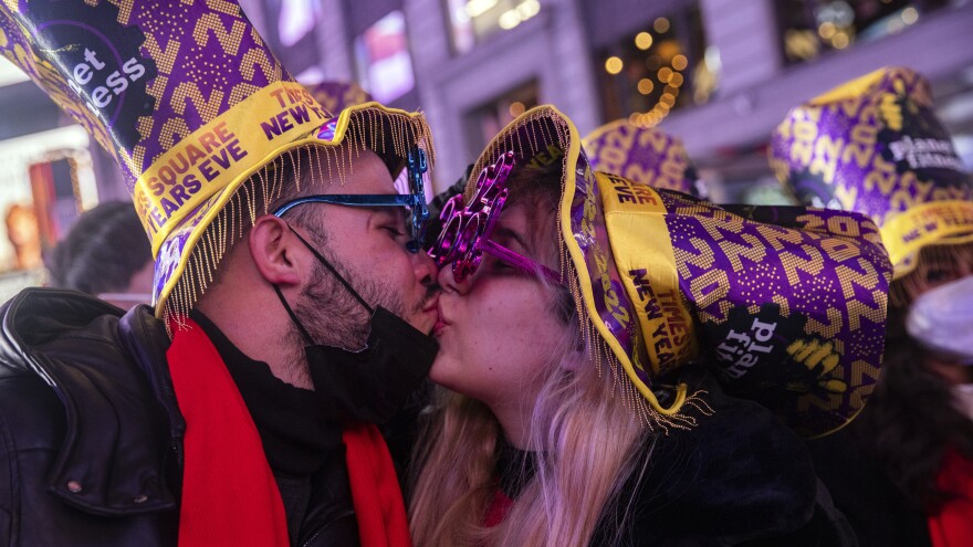 Christopher Munoz and Nirvana Contreras kiss during New Year's Eve celebrations in Times Square in New York.