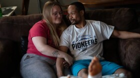 Jacob Gooch Sr. and Emily Tavis sit in their living room in Leavenworth, Kansas, three days after they were both injured by bullets at the shooting at the Kansas City Chiefs’ Super Bowl celebration in February. Gooch’s son was also shot.