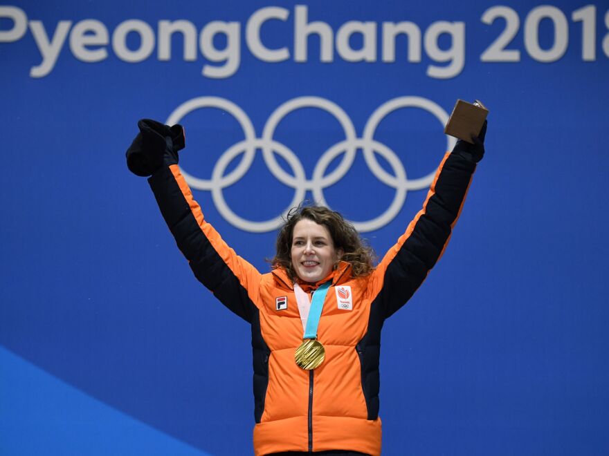 PYEONCHANG - Ireen Wust poses on the podium during the medal ceremony for the speed skating women's 1500m at the 2018 Winter Olympic Games in Pyeongchang on February 13, 2018. f(Krill Kudryavstev/AFP/Getty Images)