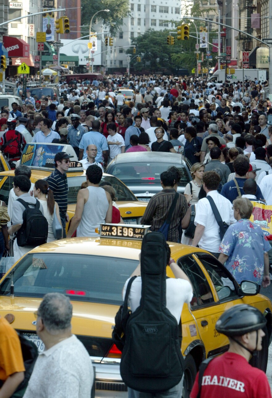 Traffic on Broadway in New York snarled with cars and pedestrians during the outage, which shut down traffic lights and subway service.