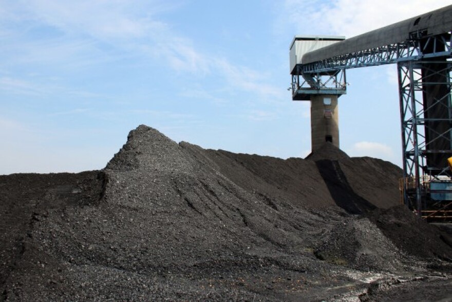 Illinois Basin coal piles up around Alliance Coal's conveyor belt at the Port of Mt. Vernon, waiting for transport on barges to regional power plants. - (File: IPB News)