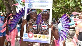 Pictured left to right: Dancers Aminisha Bailey and Ariel Roberts assisted Team WTJX at the King of the Wing competition.