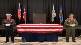 A police honor guard with the casket of retired Hamilton County Commissioner Todd Portune during his funeral service Monday at the Duke Energy Convention Center.