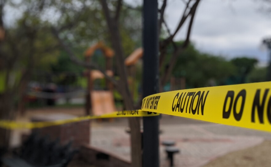 Caution tape covers Milam Park near the Children's Hospital of San Antonio.