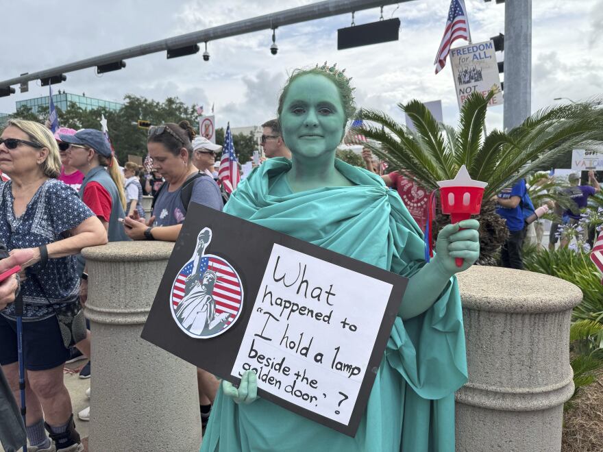 Anna Marie Shealy dressed as Lady Liberty for the "No Kings" protest in Tallahassee, Fla. on June 14, 2025. (AP Photo/Kate Payne)