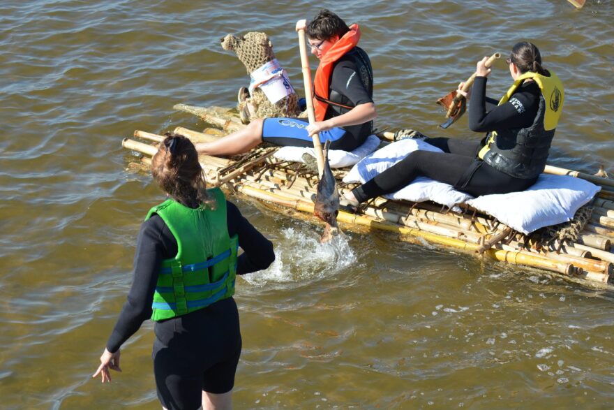 From left: Annette Westfall, 57, and her daughters Rachel and Kelly, finish the Repurpose-It Regatta on Saturday. Annette Westfield spent a few days crocheting the mascot named "Lucky Dog".